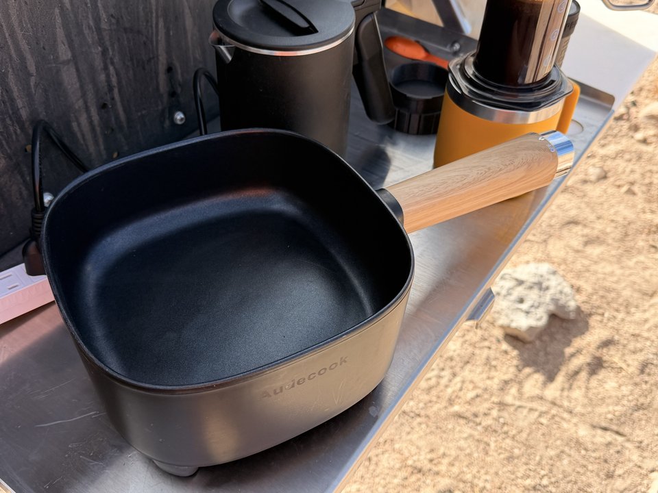 The Emily Pan Pan, an Audecook electric cooker, on the camp kitchen counter