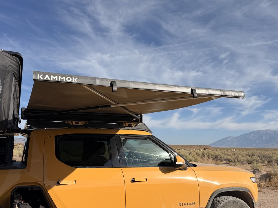Kammok Crosswing awning fully deployed above the Rivian cab