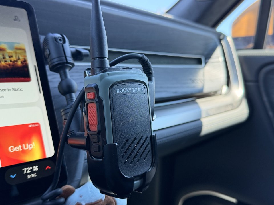 Rocky Talkie radio mounted on the dash with its antenna extended