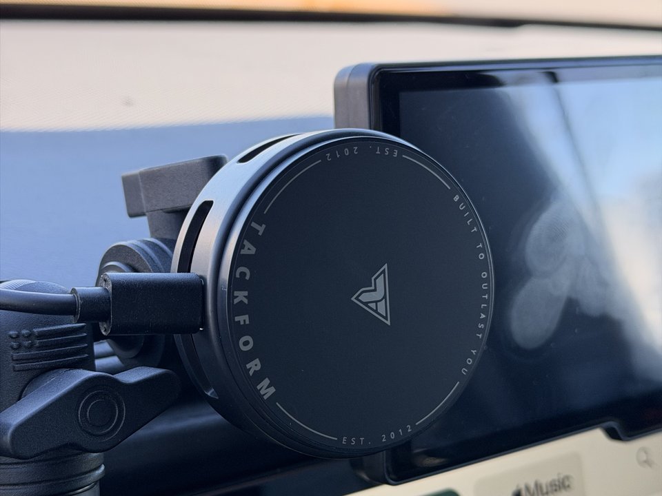 Tackform MagSafe mount holding the phone above the center display