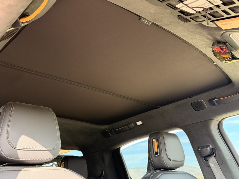 Roof shade fitted beneath the glass roof panel inside the cab